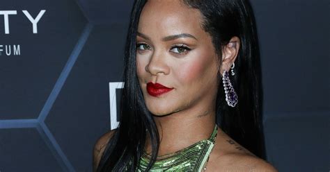 Rihanna delights over growing boobs as she discusses。